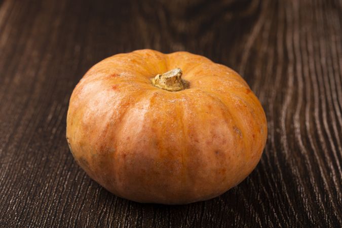 Pumpkins on the wooden table.