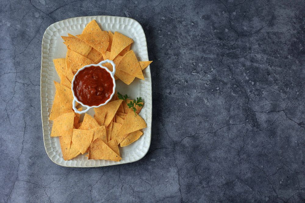 Top View Crispy Nachos with Tomato Sauce Dipping