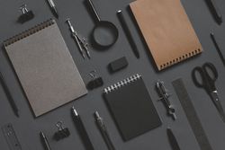 Stationary organized neatly on dark background