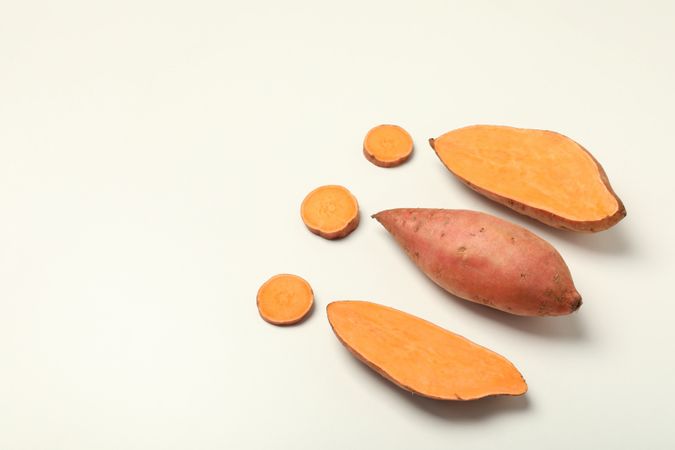 Fresh cut sweet potato on a light background