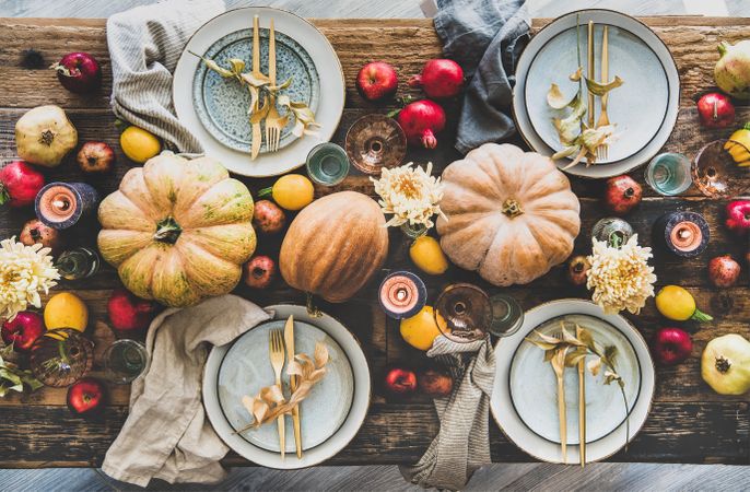 Fall table setting for Thanksgiving day party or family gathering dinner