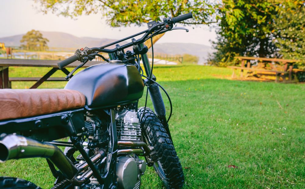 Custom motorcycle parked on the grass