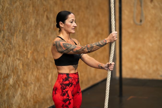 Woman standing with rope in gym