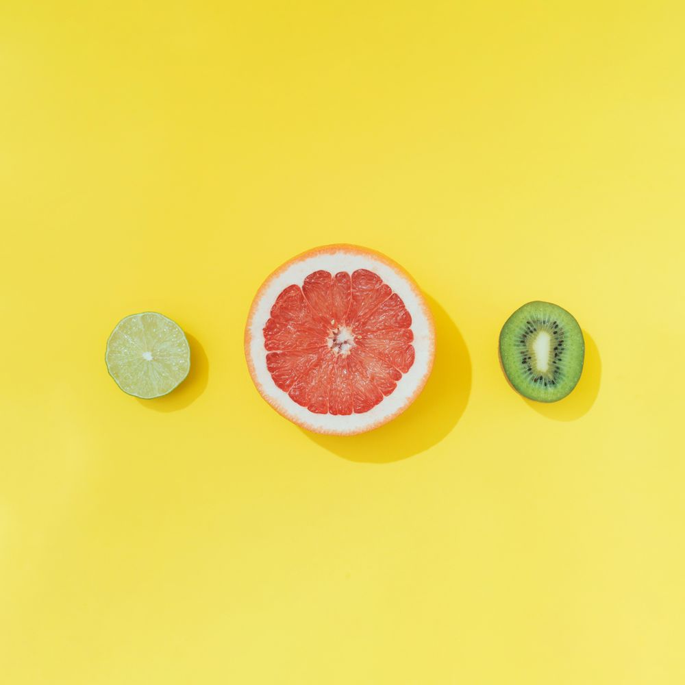 Tropical fruit on pastel yellow backround