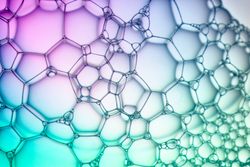 Abstract background bio technology, macro photography foam and water with gradient background. Molecule multicolor backgorund