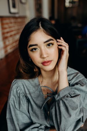 Portrait of woman in gray shirt