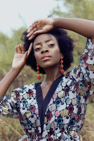 Portrait of Black woman in colorful shirt outdoor