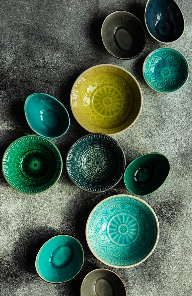 Empty ceramic bowls on stone background