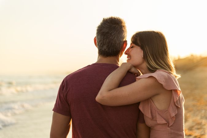 Adult couple embracing near sea