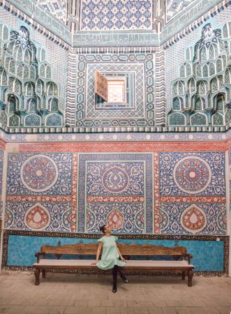 Unrecognizable tourist inside ancient building