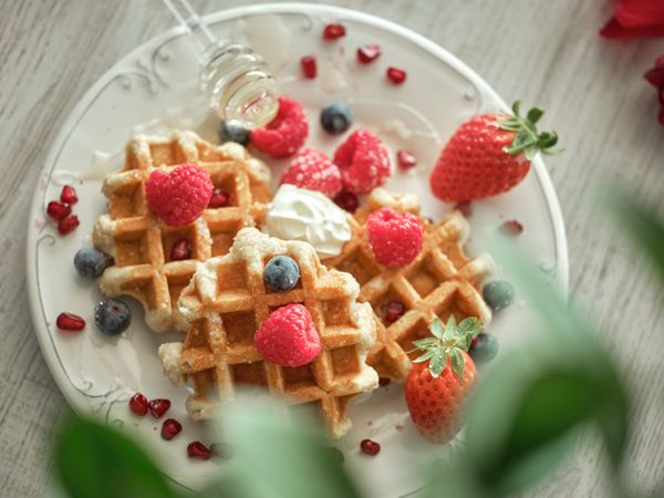 Tasty waffles served with berries