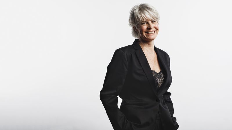 Portrait of businesswoman with gray hair looking at camera