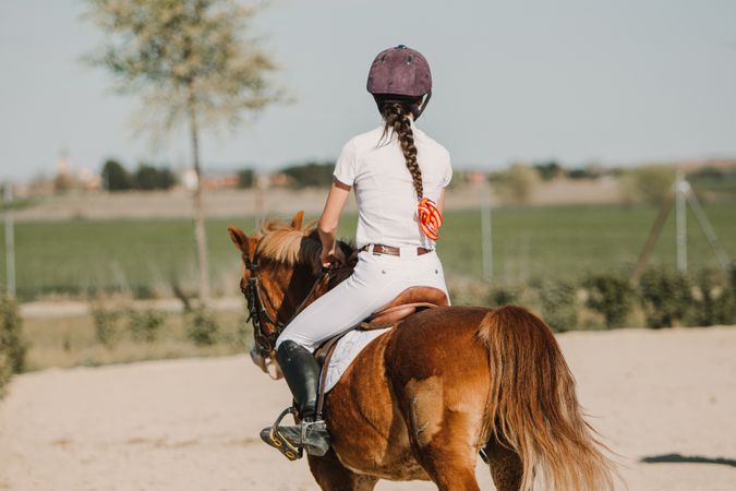 Girl riding horse