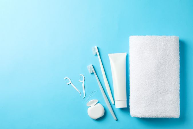 Tools for dental care on blue background, space for text