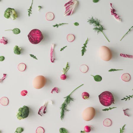 Colorful vegetable pattern made of broccoli, eggs, beetroot and radish