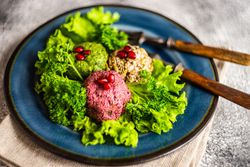 Plate of vegetable Georgian dish pkhali on a bed of lettuce
