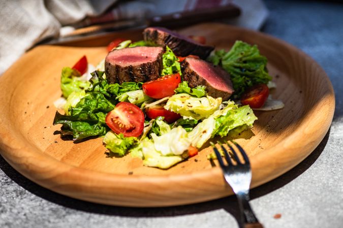Delicious steak salad with fresh lettuce and tomatoes