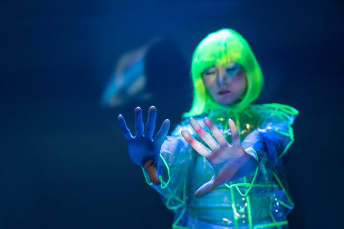 Asian woman posing in fluorescent light