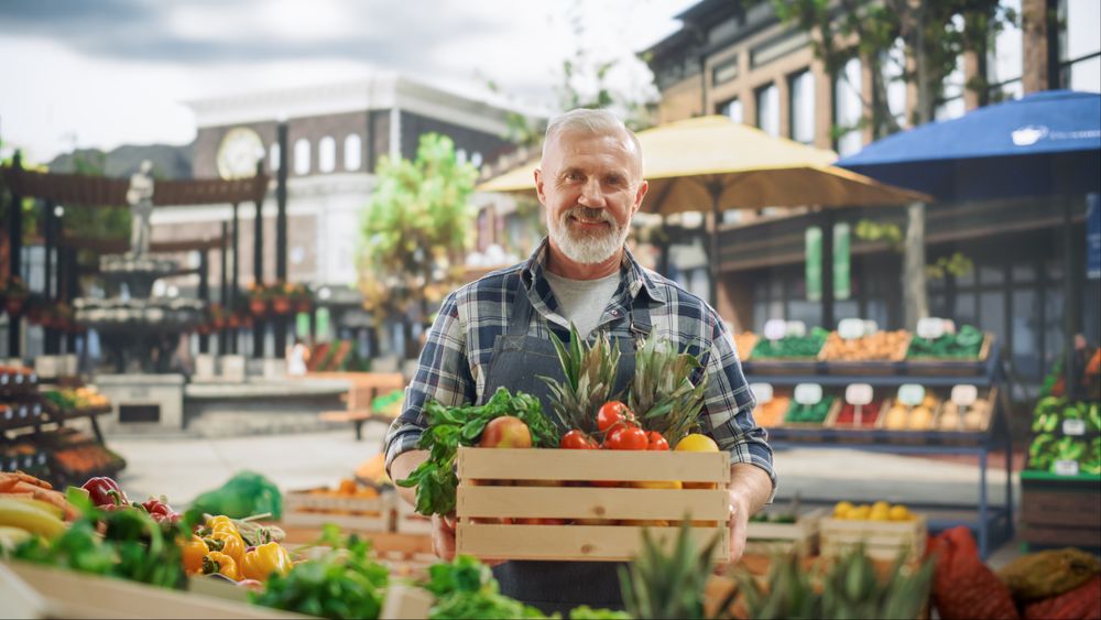 Successful Farmer Posing and Cheerfully Smiling on Camera.