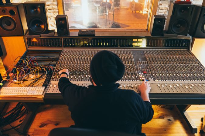 Man in a equalizer instrument in a studio