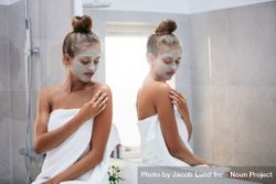 Female doing skin treatment after bath 411E84