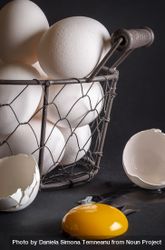 Eggs in a basket and a cracked egg 48Zyk0