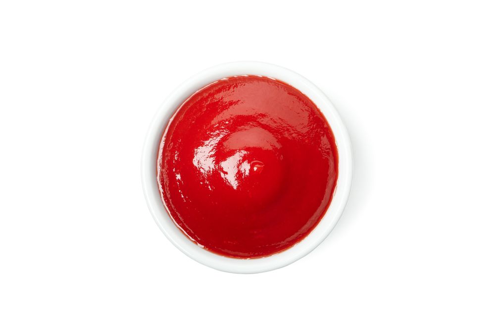 Bowl of tomato sauce isolated on blank background