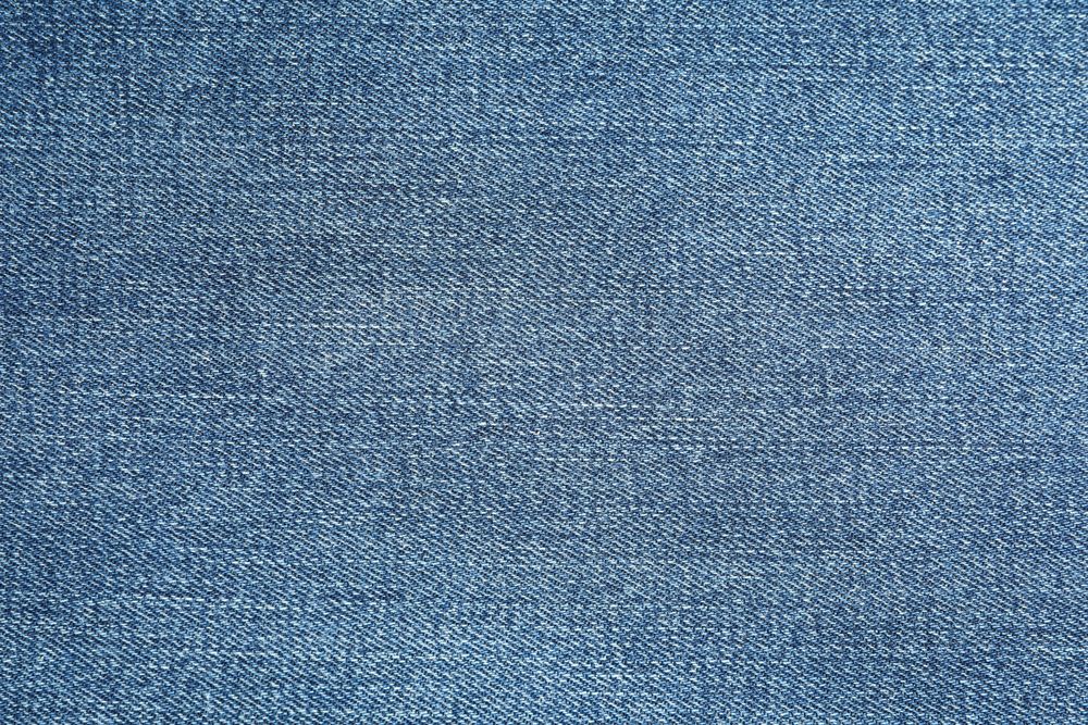 Texture of blue jeans as background, space for text