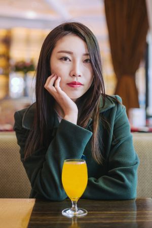 Asian woman sitting in cafe