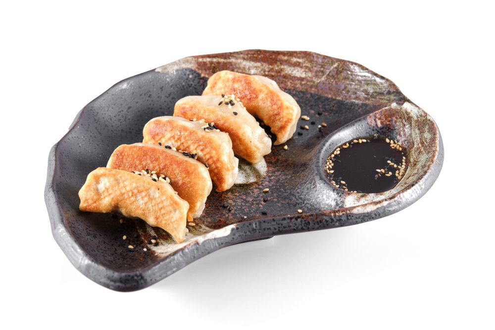 Fried Chinese dumplings with soy sauce