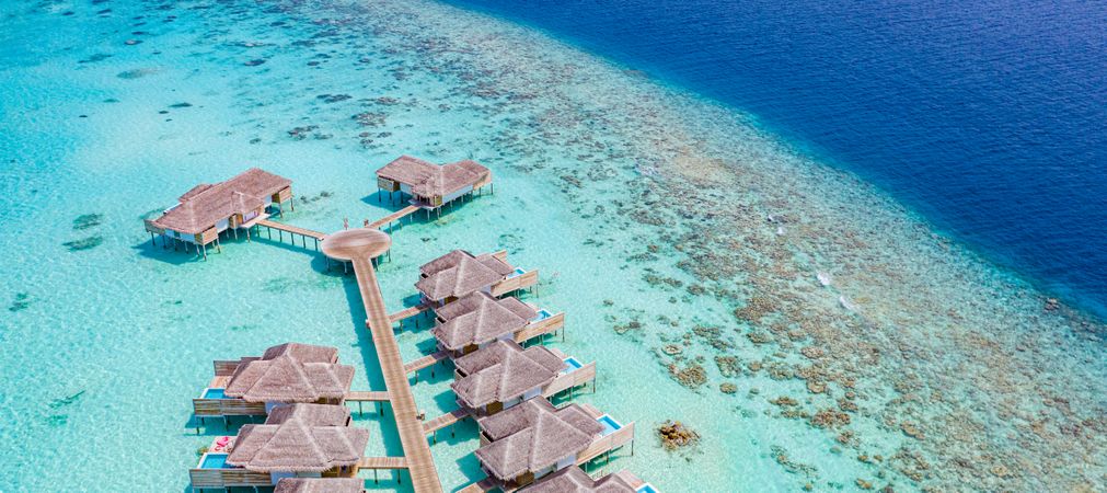 Two rows of overwater bungalows in the Maldives, wide shot