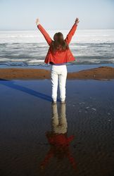Young adult woman outdoors enjoying icy landscape