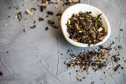 Floral tea in a bowl with copy space