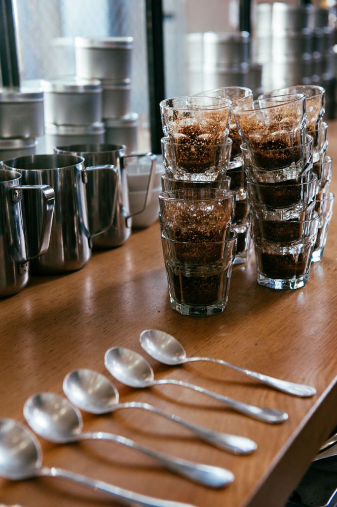 Spoons laid out on counter ready for coffee tasting