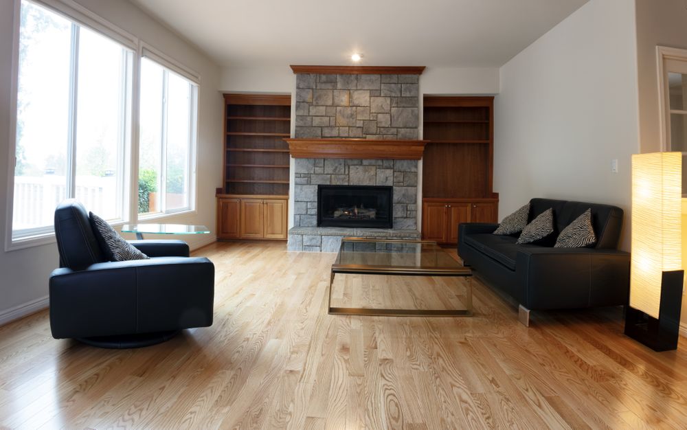 Family room remodeled with solid red oak wooden floors and new furniture