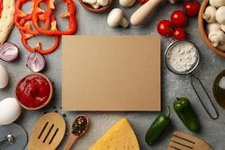 Ingredients for cooking and space for text on gray background