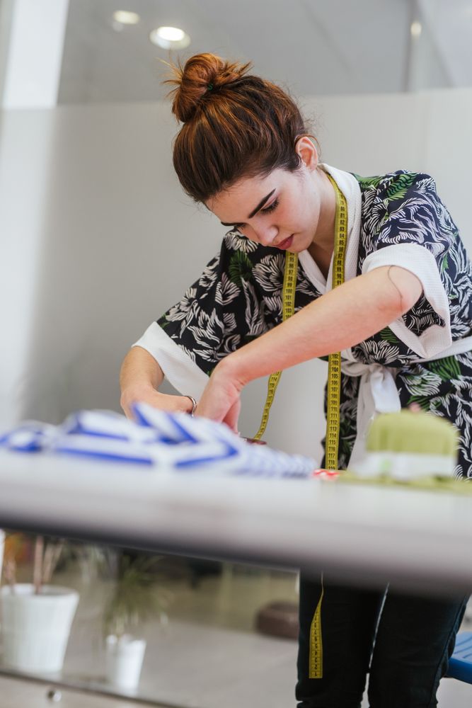 Woman in a sewing school