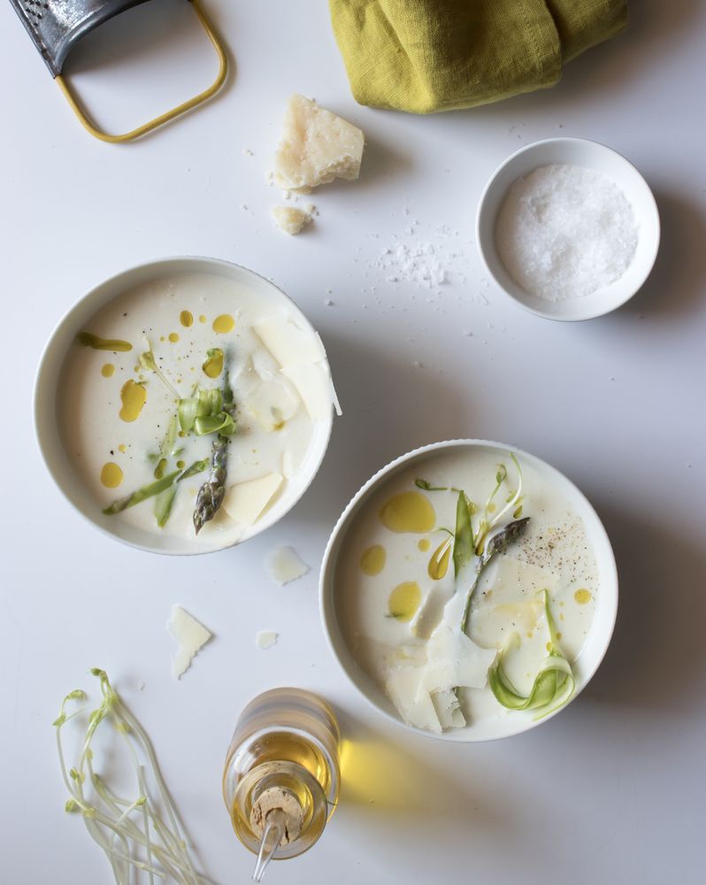 Kitchenware and condiments near asparagus cream soup