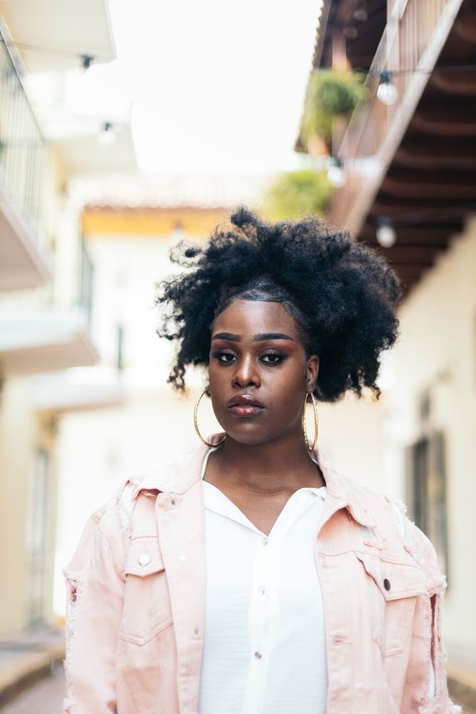 Portrait of a pretty Black woman with afro hair