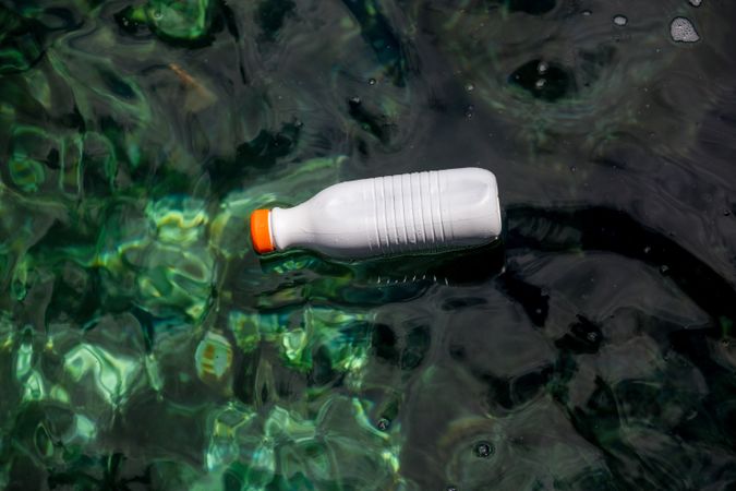 Plastic bottle floating on water
