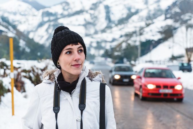 Woman walking in snowy mountains