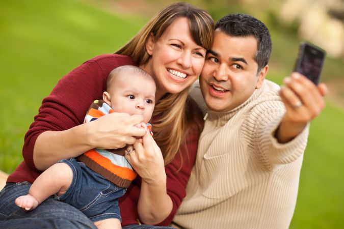 Happy Parents and Baby Boy Taking Self Portraits