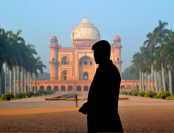 Silhouette of man standing near Safdarjung's tomb in Delhi, Delhi, India