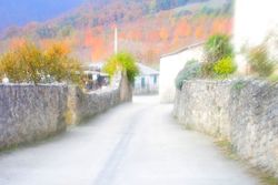 Blurred narrow street in village