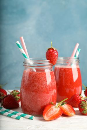 Composition with strawberry cocktails on wooden table. Summer berry