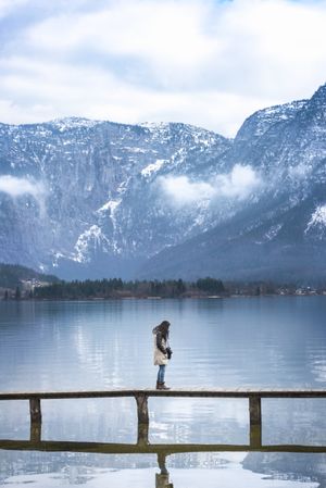 Woman on a bridge in the Austrian Alps