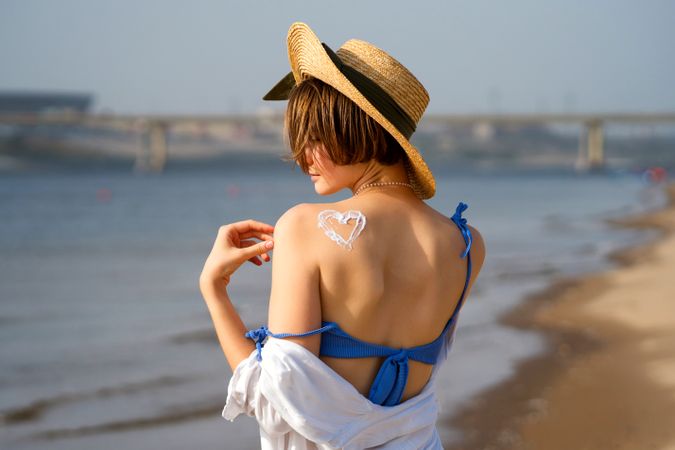 Woman with Sunscreen in heart shape