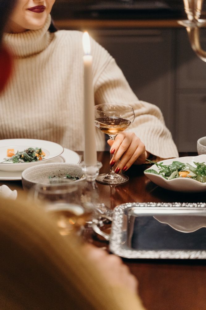 Cropped image of people sitting at a dinner table
