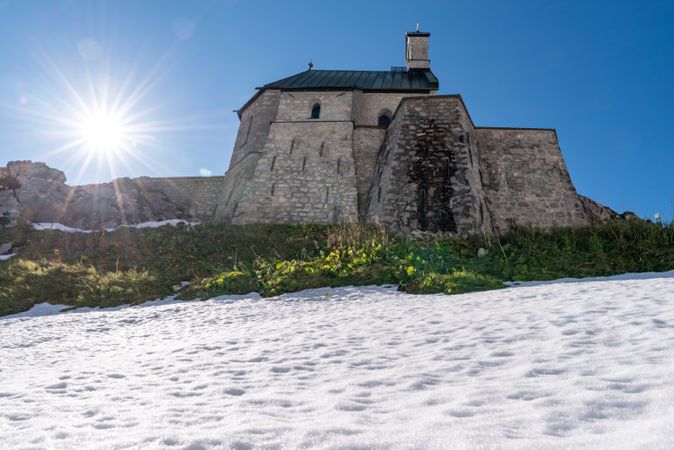 Medieval church on mountaintop in the Bavarian Alps on a sunny day in September