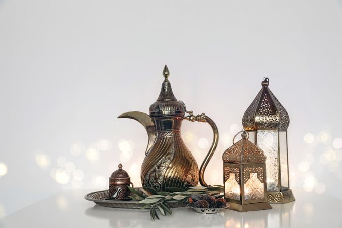 Glowing Moroccan ornamental lanterns, Arabic dallah coffee pot